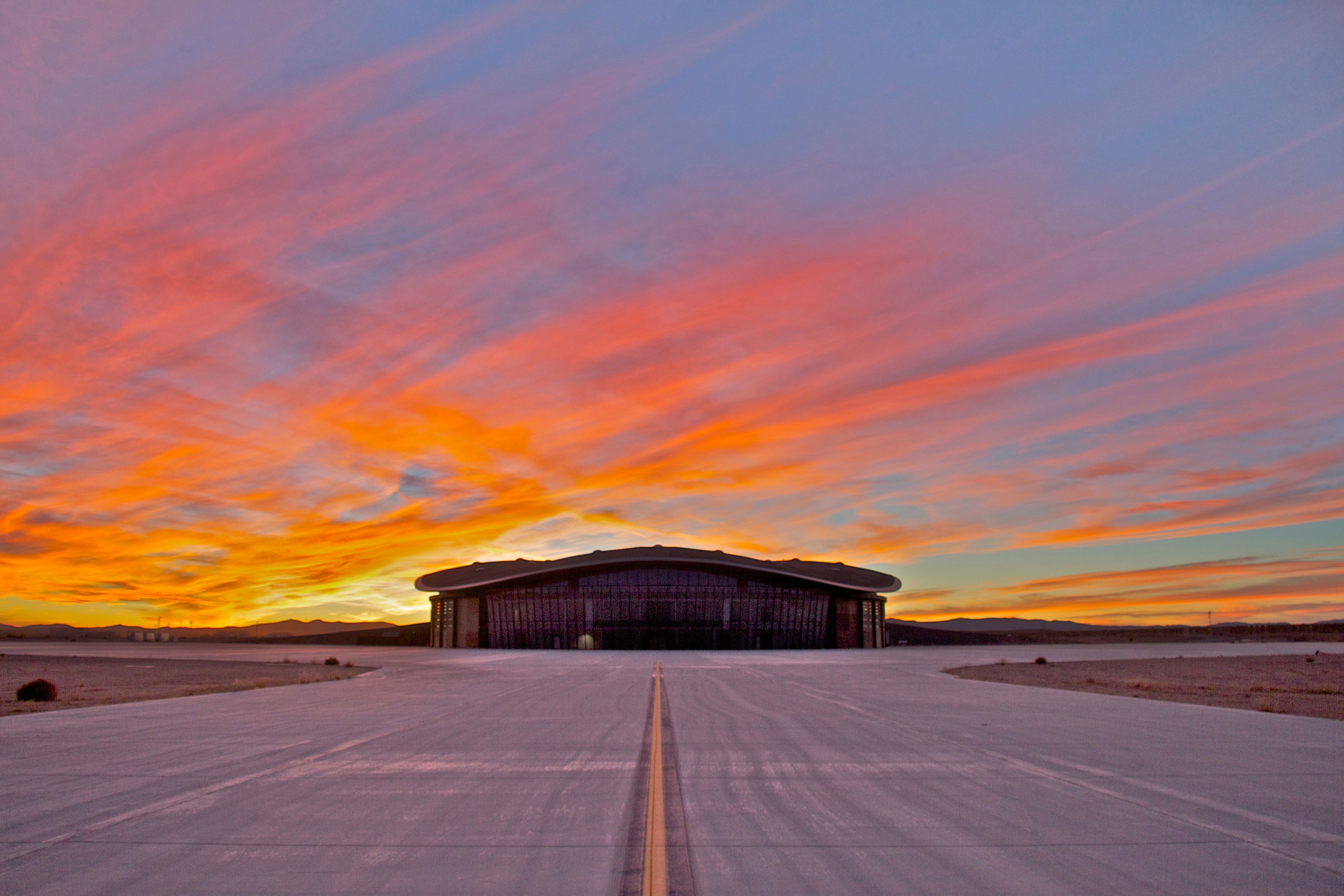 A spectacular New Mexico sunset as backdrop to the Virgin Galactic Gateway to Space terminal. Credit: Spaceport America.