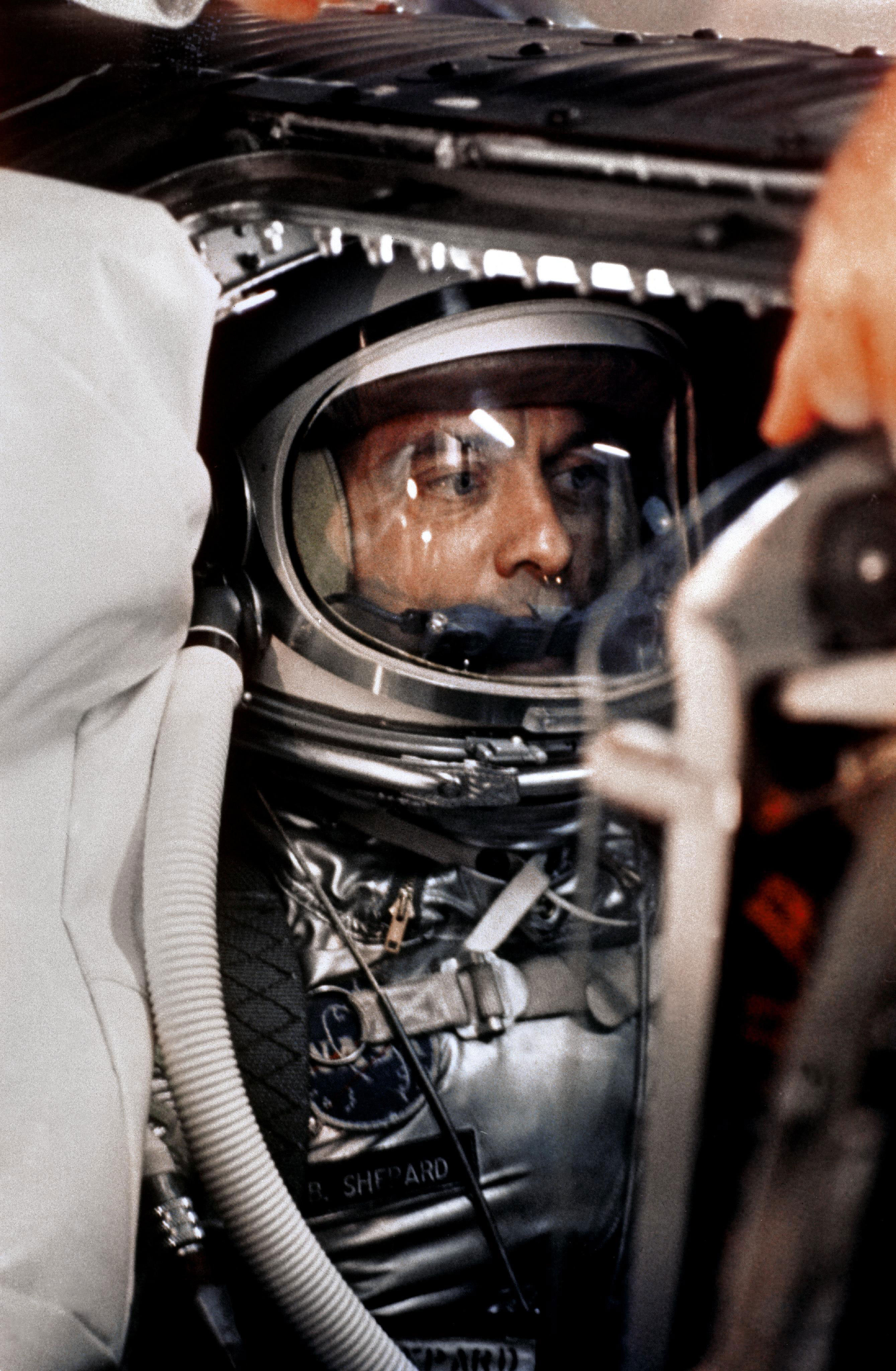 Alan Shepard in his space suit seated inside the Mercur y capsule. Credit: NASA/Bill Taub
