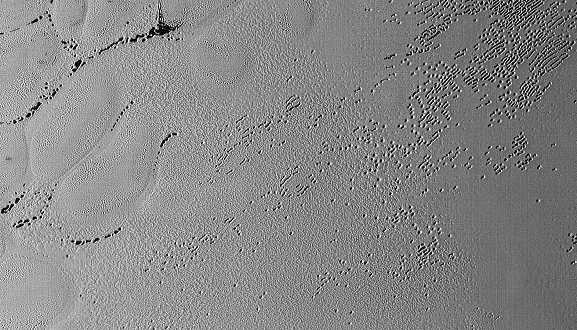 Figure 10: Pitted terrain on Sputnik Planum. Credit: NASA/JHUAPL/SwRI