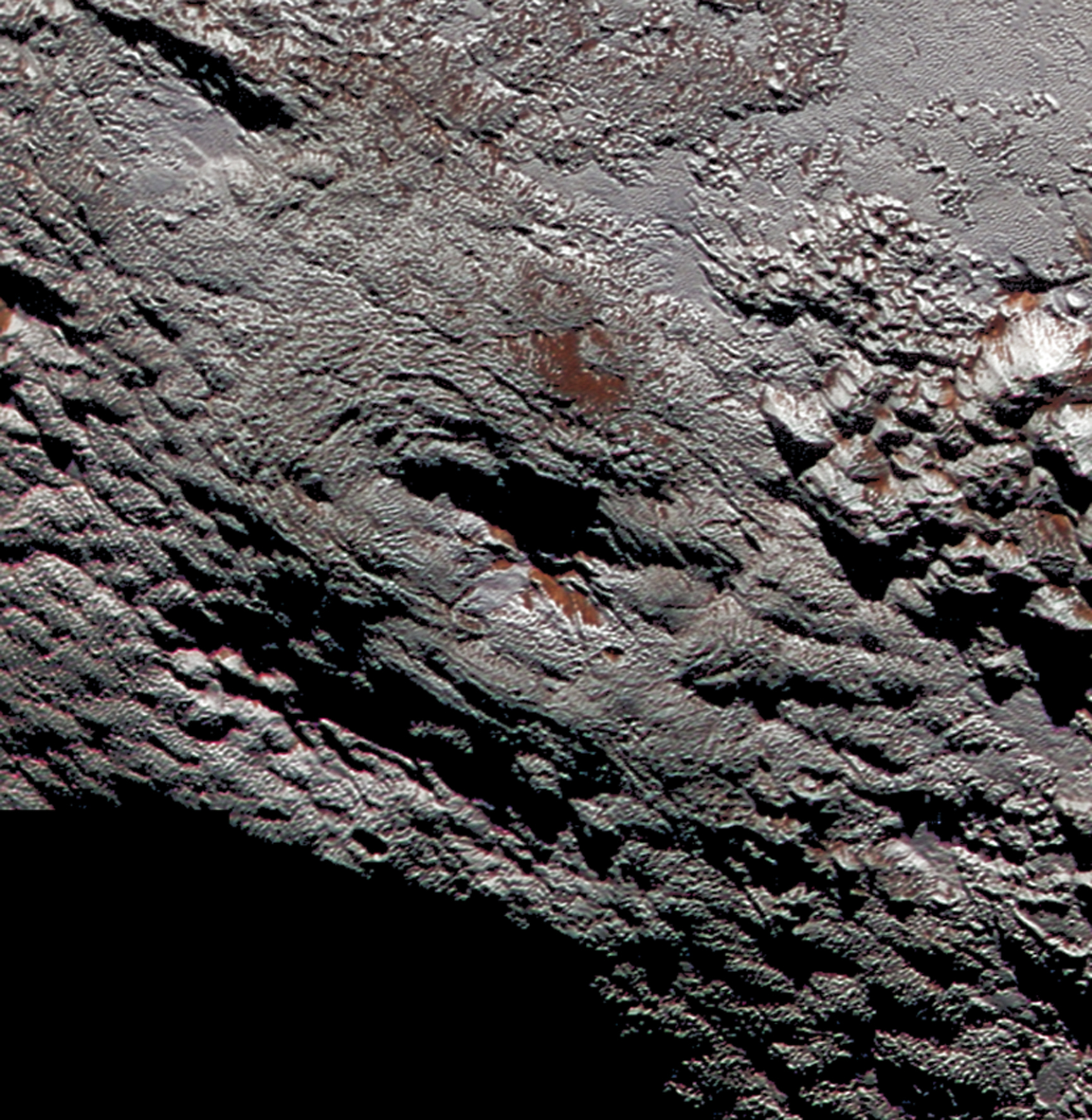 Figure 14: This rounded mountain, named Wright Mons, has what appears to be a summit crater. It is one of two candidates for evidence of possible recent cryovolcanism seen on Pluto by New Horizons. Credit: NASA/JHUAPL/SwRI