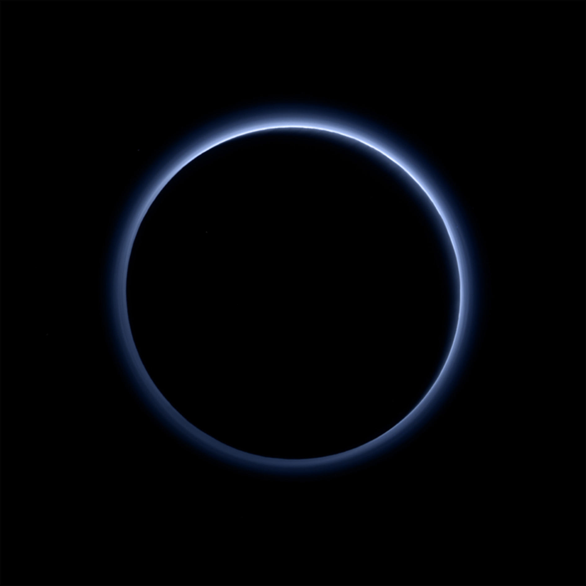 Figure 16: Pluto’s ‘blue skies’, imaged by New Horizons’ Ralph/ Multispectral Visible Imaging Camera (MVIC). This blue colour results from the scattering of sunlight by very small particles, in this case probably tholins, soot-like particles created by complex chemical reactions of nitrogen and methane initiated by ultraviolet light from the Sun. Credit: NASA/JHUAPL/SwRI