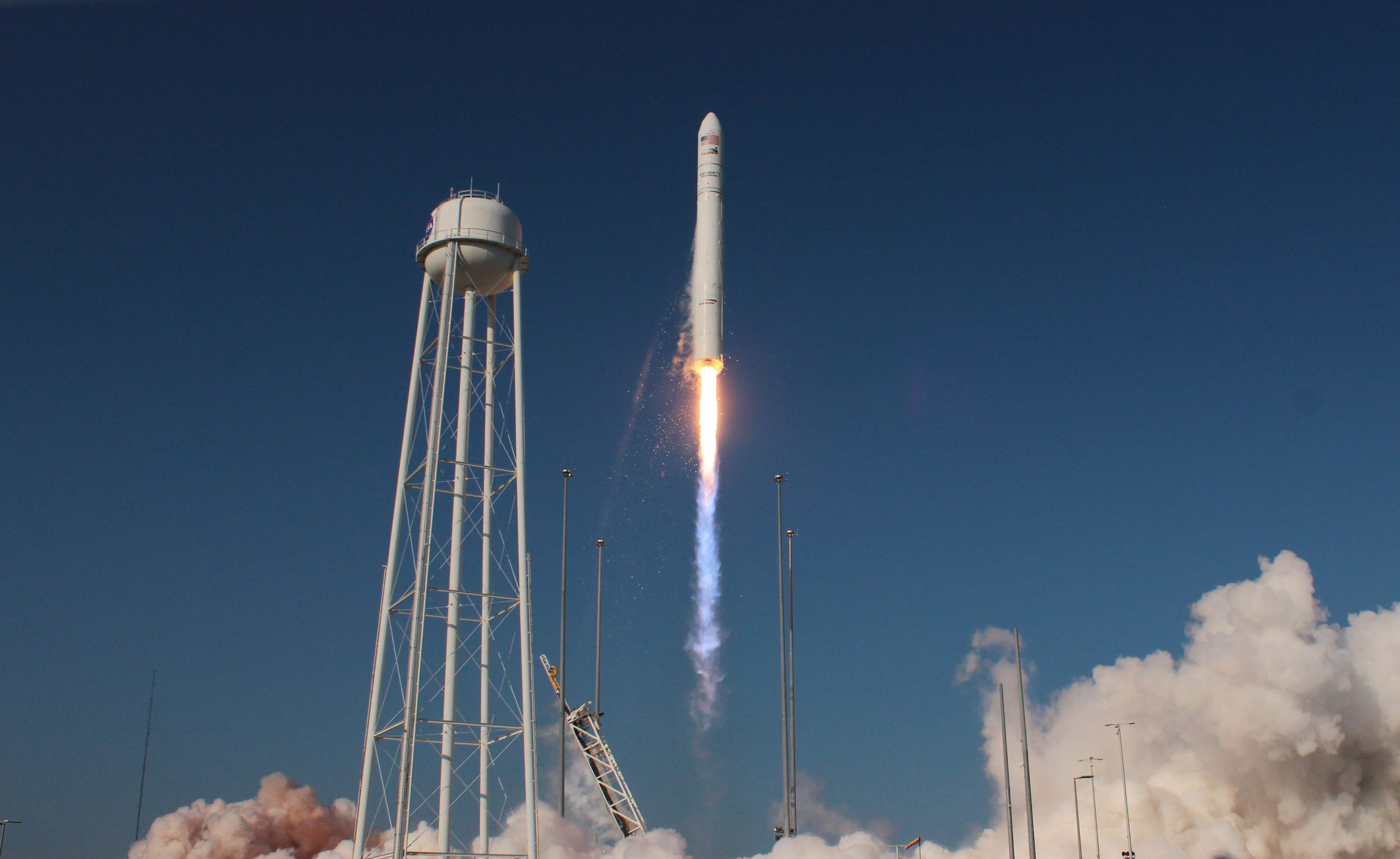 antares rocket soars into sky during launch from wallops island, virginia