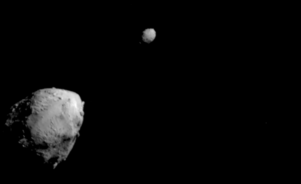 asteroid Didymos and orbiting moonlet Dimorphos in space