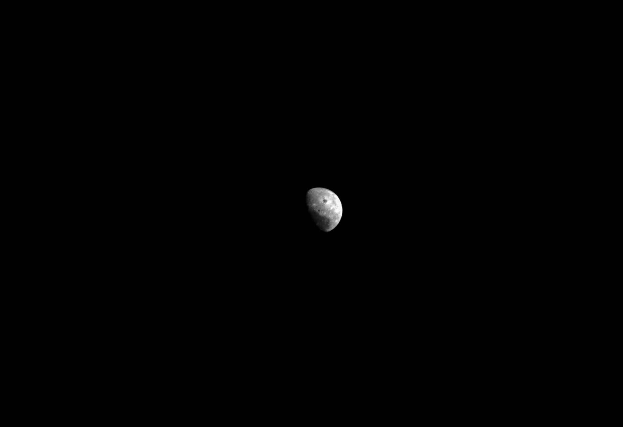 moon from far away as photographed by orion spacecraft